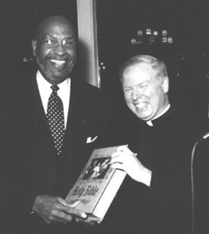 Warner Saunders and Father Michael Gilligan