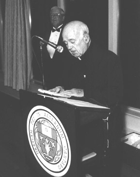 Father Matt Hoffman, singing grace before meals