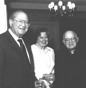 Professor Richard Michael, Mary Michael, and Father Matt Hoffman