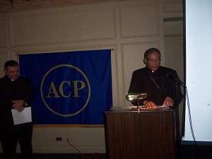 Bishop Perry, saying grace before meals