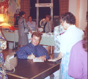 Dan Schutte signing his name