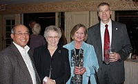 Father Tri Van Tran, pastor of St. Mary's, Park Forest, (left) and some members of the parish