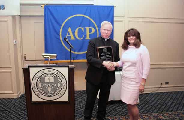 Jackie Moffitt, receiving the Henry Hyde Award