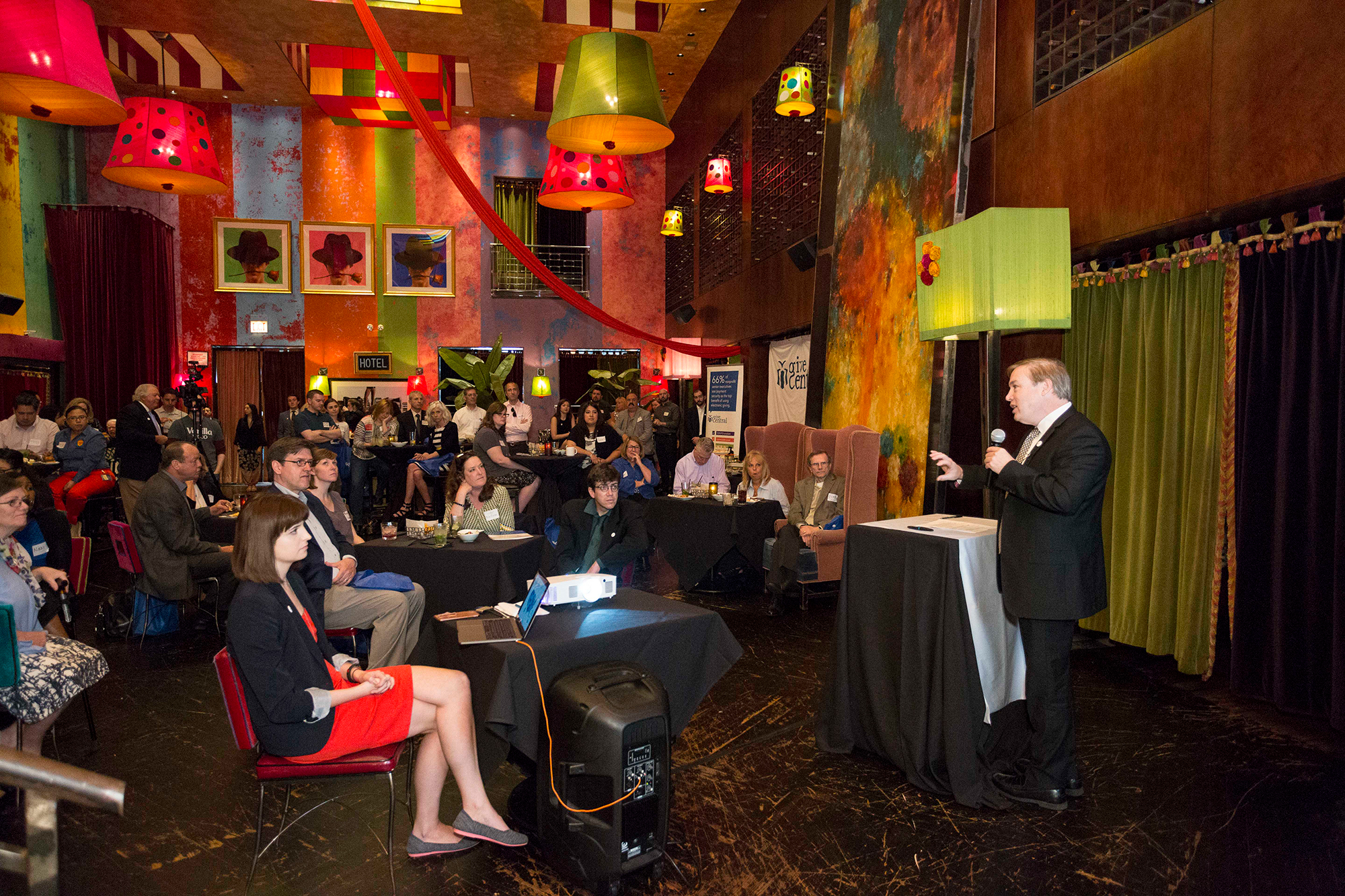 May, 2018, in Carnivale Restaurant, on Fulton Street in Chicago. In this image, you see Patrick explaining the benefits of the new Give Central program, provided by the Coleman Group.