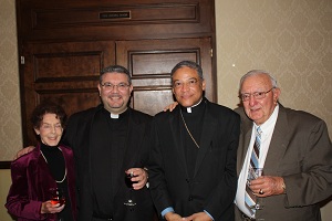 Bishop Joseph Perry with Father Simonetti and his parents.