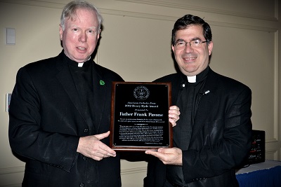 Father Michael Gilligan, conferring the Henry Hyde Award on Father Frank Pavone