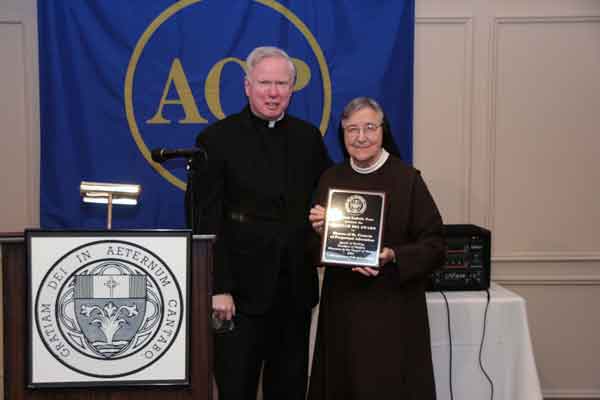 Sister Jane Klein receiving the Gratiam Dei Award